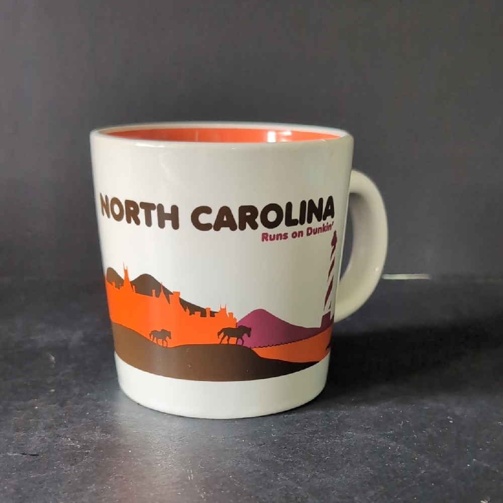 2012 Dunkin Donuts North Carolina Orange/Off-white Ceramic Coffee Mug.